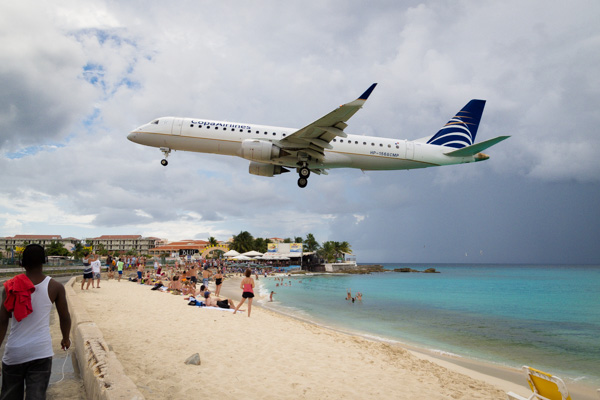 A Copa Airlines Airbus lands on Runway 10 at Princess Juliana Airport on Sint Maarten giving beach-goers quite a show