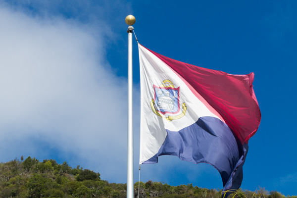The flag of Sint Maarten, a 'new country within the Kingdom of the Netherlands.'  Its colors are the same as the Dutch flag and is similar to the Philippine wartime flag.