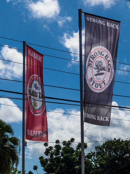 Advertising banners for the Bahamian Brewery and Beverage Co outside a beer store on Nassau