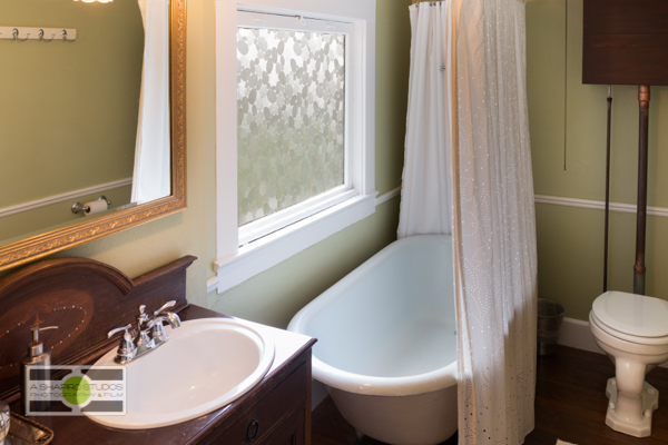 The bathroom, featuring a clawfoot tub, of a Phinney Ridge Craftsman-style Nice Seattle Home - Listing soon! ©2014 Ari Shapiro - AShapiroStudios.com