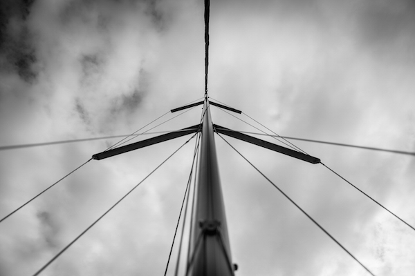 The mast stands tall on this 38' Defour with ominous skies and a halyard slapping against the pole. Fine Art Metallic Print from AShapiro Studios