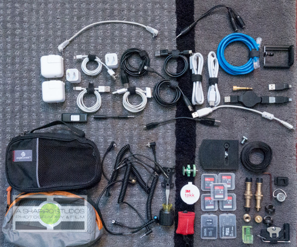 Small cables, adapters, chargers, etc - the accessories I travel with.  Photography by Ari Shapiro - AShapiroStudios.com