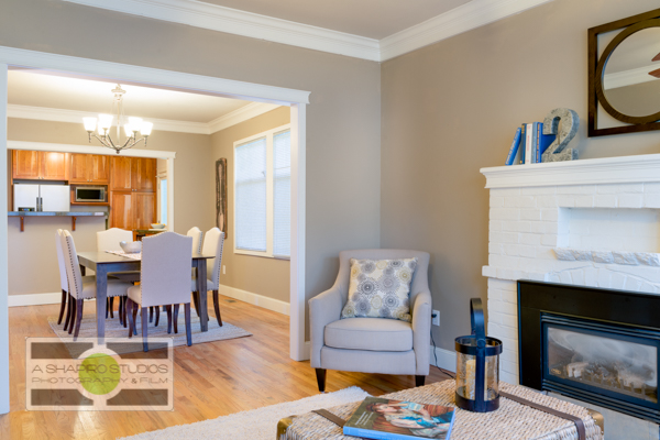 An open-concept living and dining room of a Ballard updated Craftsman house.  Seattle Real Estate Photography ©2015 Ari Shapiro - AShapiroStudios.com