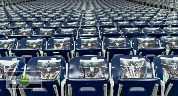 Roll-banners were attached to seats throughout NRG Stadium as part of the launch of Allstate's new #EnviaMalaSuerte campaign. Houston Event Photography ©2015 Ari Shapiro - AShapiroStudios.com