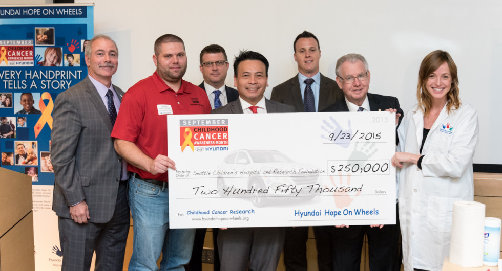 As part of the $10.5M being donated to various medical centers across the country, children receiving treatment for cancer at Seattle Children's Hospital were among the attendees of the ceremony where representatives from Hyundai, including local dealers, presented a $250,000 grant to the hospital to fund treatment programs as part of the Hope On Wheels program.  Seattle Corporate Event Photography ©2015 Ari Shapiro - AShapiroStudios.com