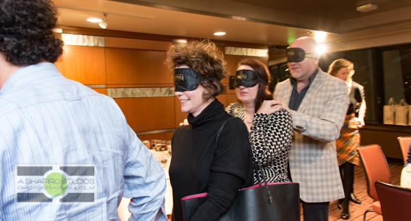 At the Space Needle in Seattle, members of the media and VIPs were invited to a Tasting In The Dark of Francis Ford Coppola wines. This sensory experience challenged guests to pick out aromas of base flavors then a flight of 4 of the company's bottlings - all while blindfolded. Hobey Wedler, a graduate student working toward his PhD in Chemistry (and blind since birth) led the group through the experience. Seattle Corporate Event Photography ©2015 Ari Shapiro - AShapiroStudios.com