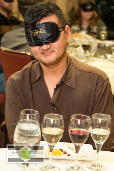At the Space Needle in Seattle, members of the media and VIPs were invited to a Tasting In The Dark of Francis Ford Coppola wines. This sensory experience challenged guests to pick out aromas of base flavors then a flight of 4 of the company's bottlings - all while blindfolded. Hobey Wedler, a graduate student working toward his PhD in Chemistry (and blind since birth) led the group through the experience. Seattle Corporate Event Photography ©2015 Ari Shapiro - AShapiroStudios.com