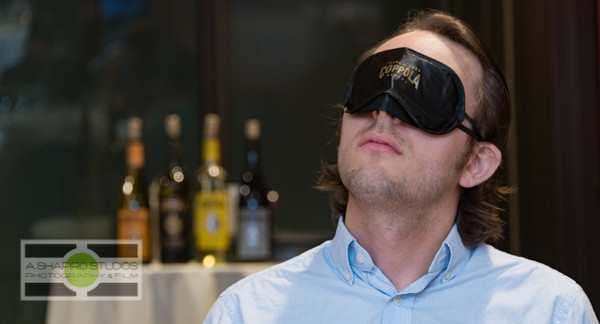 At the Space Needle in Seattle, members of the media and VIPs were invited to a Tasting In The Dark of Francis Ford Coppola wines. This sensory experience challenged guests to pick out aromas of base flavors then a flight of 4 of the company's bottlings - all while blindfolded. Hobey Wedler, a graduate student working toward his PhD in Chemistry (and blind since birth) led the group through the experience. Seattle Corporate Event Photography ©2015 Ari Shapiro - AShapiroStudios.com