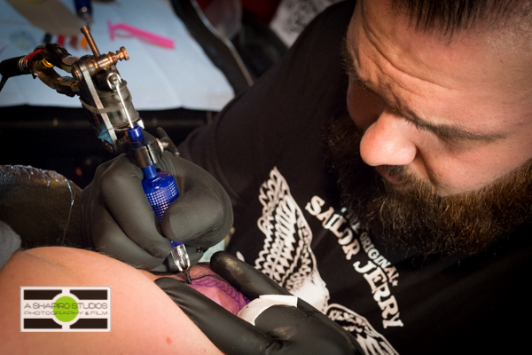 At Seattle's King's Hardware, tattoo artists worked for hours giving bar-goers free tattoos. Seattle Event Photography @2014 Ari Shapiro - AShapiroStudios.com